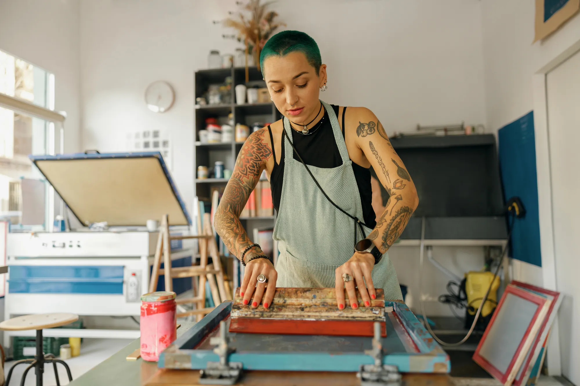 An artist painting in her studio