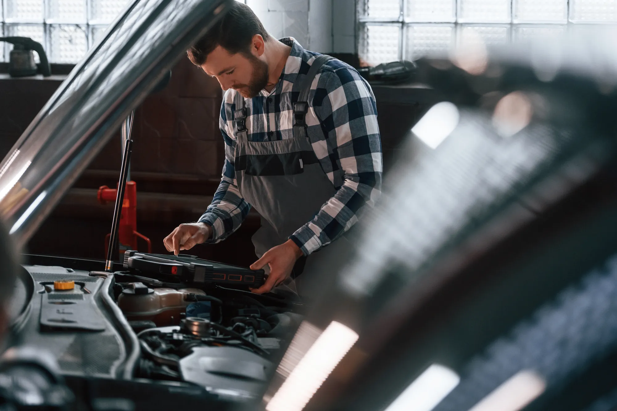 A mechanic repairing a car