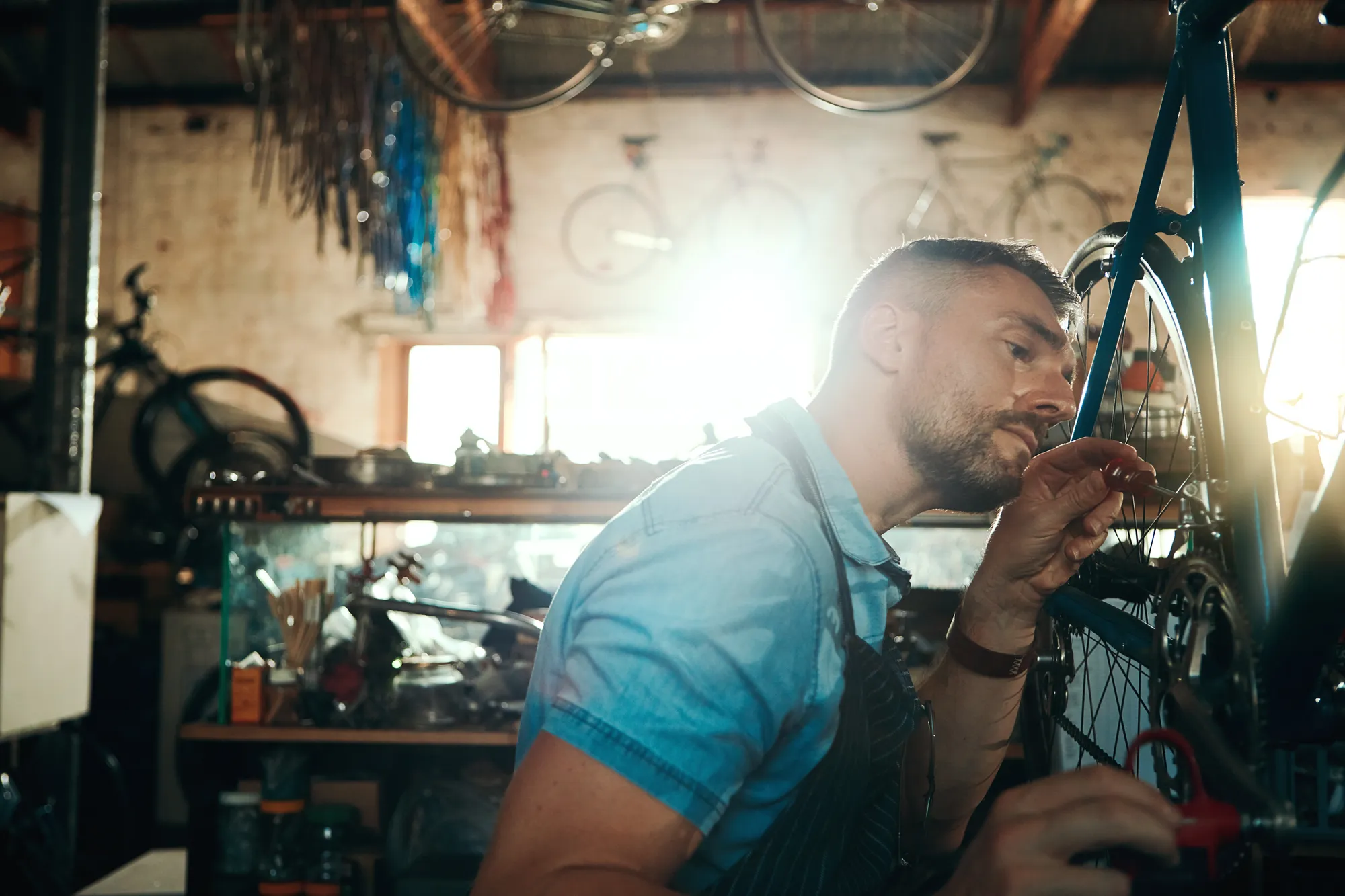 A mechanic servicing a bicycle