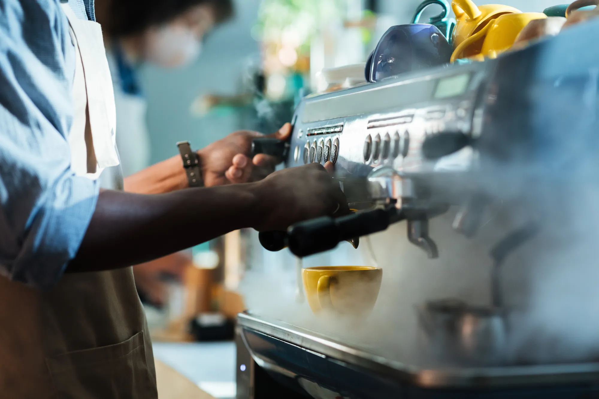 A barista pulling a shot of espresso