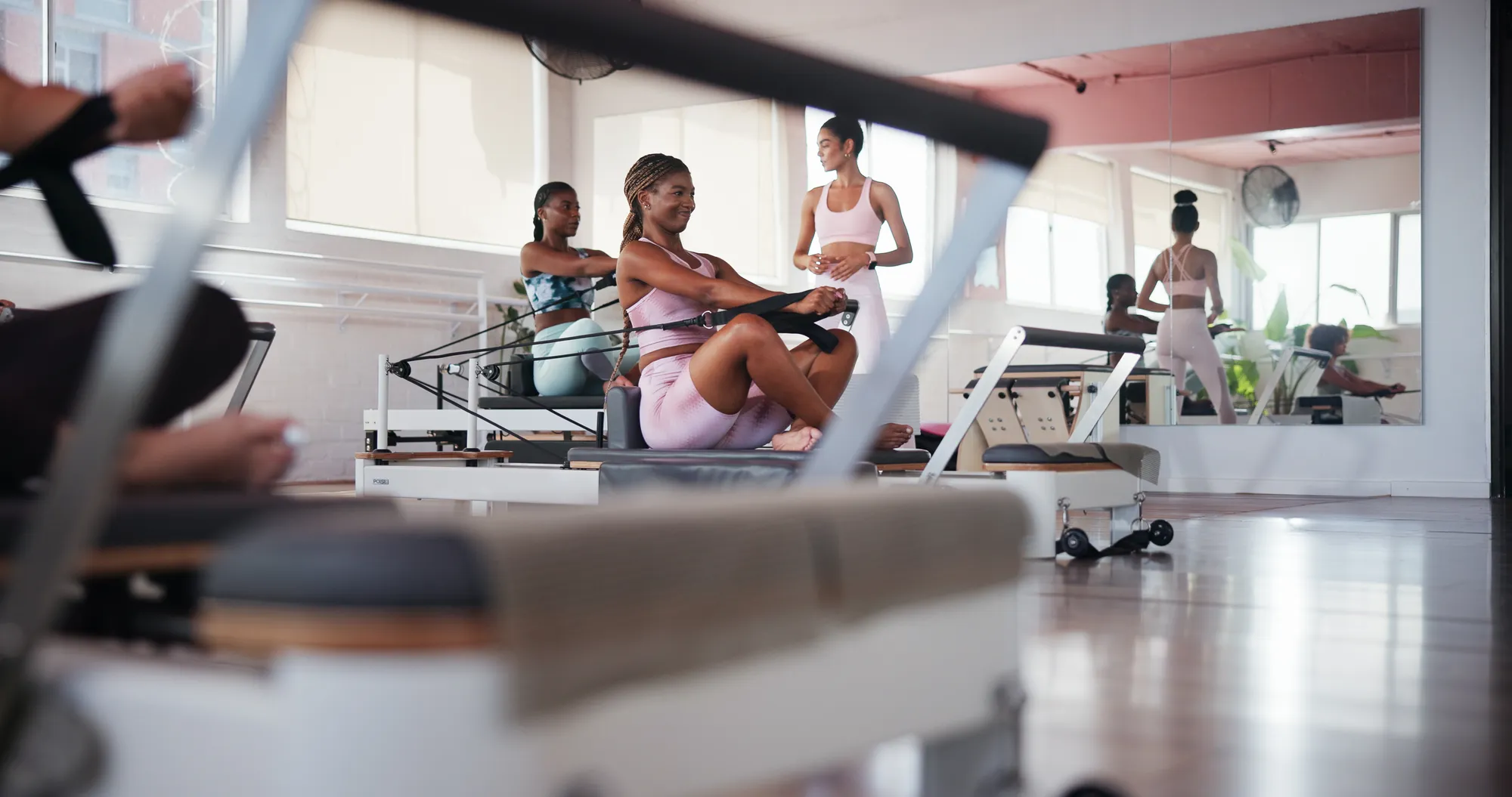 An instructor leading a pilates class