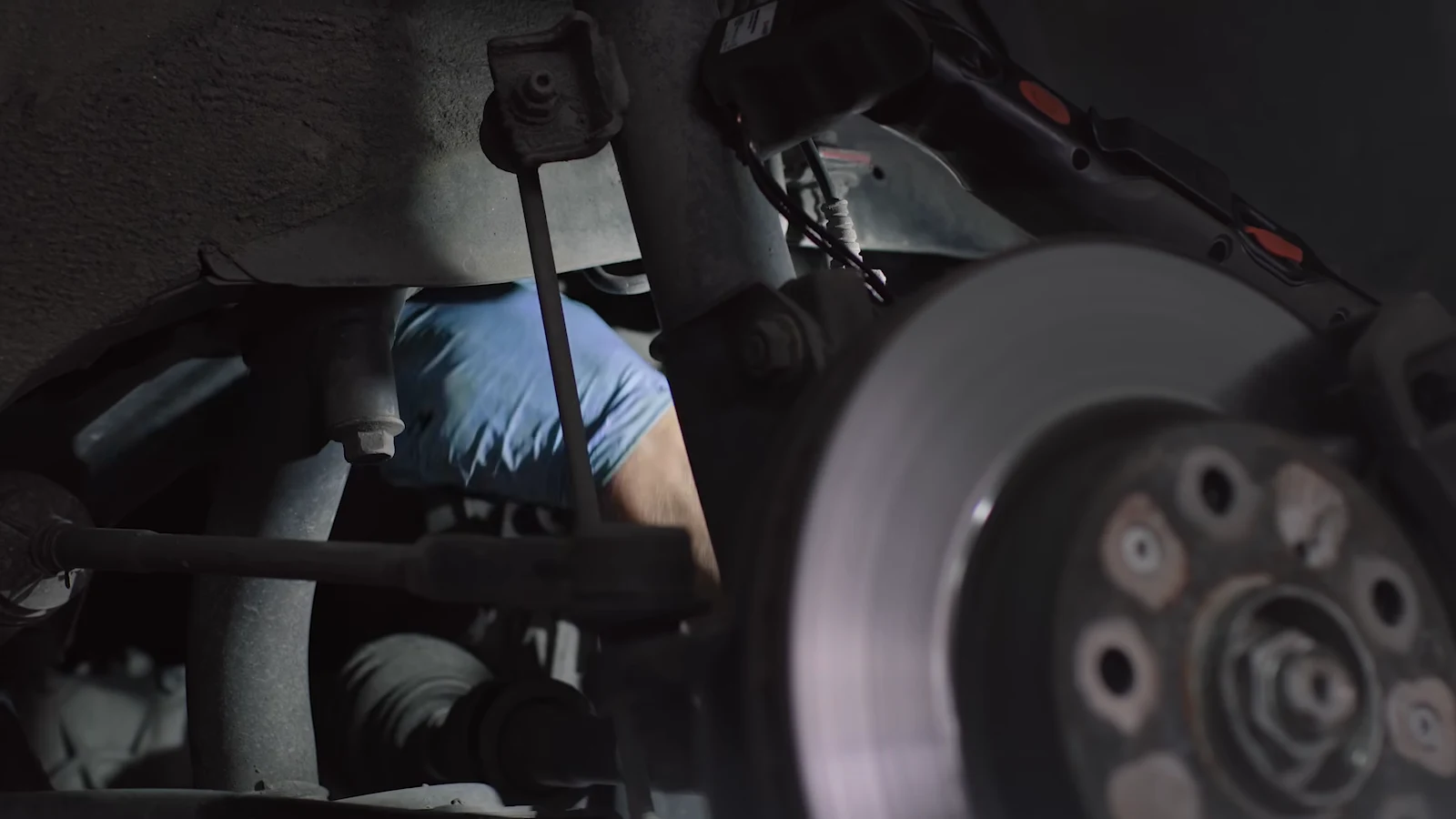 A mechanic servicing a bicycle