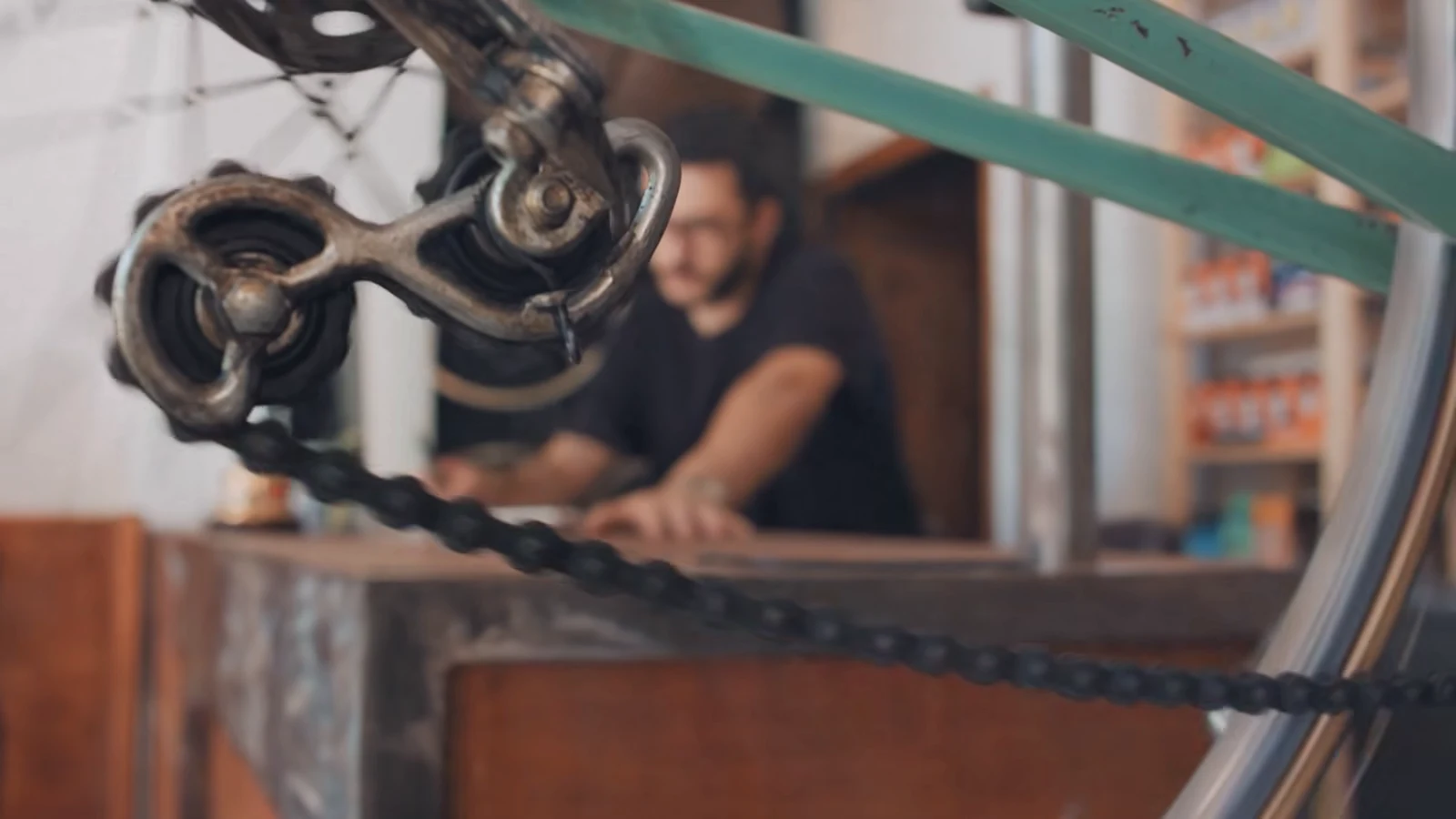 Mechanics servicing a bike in a bike shop